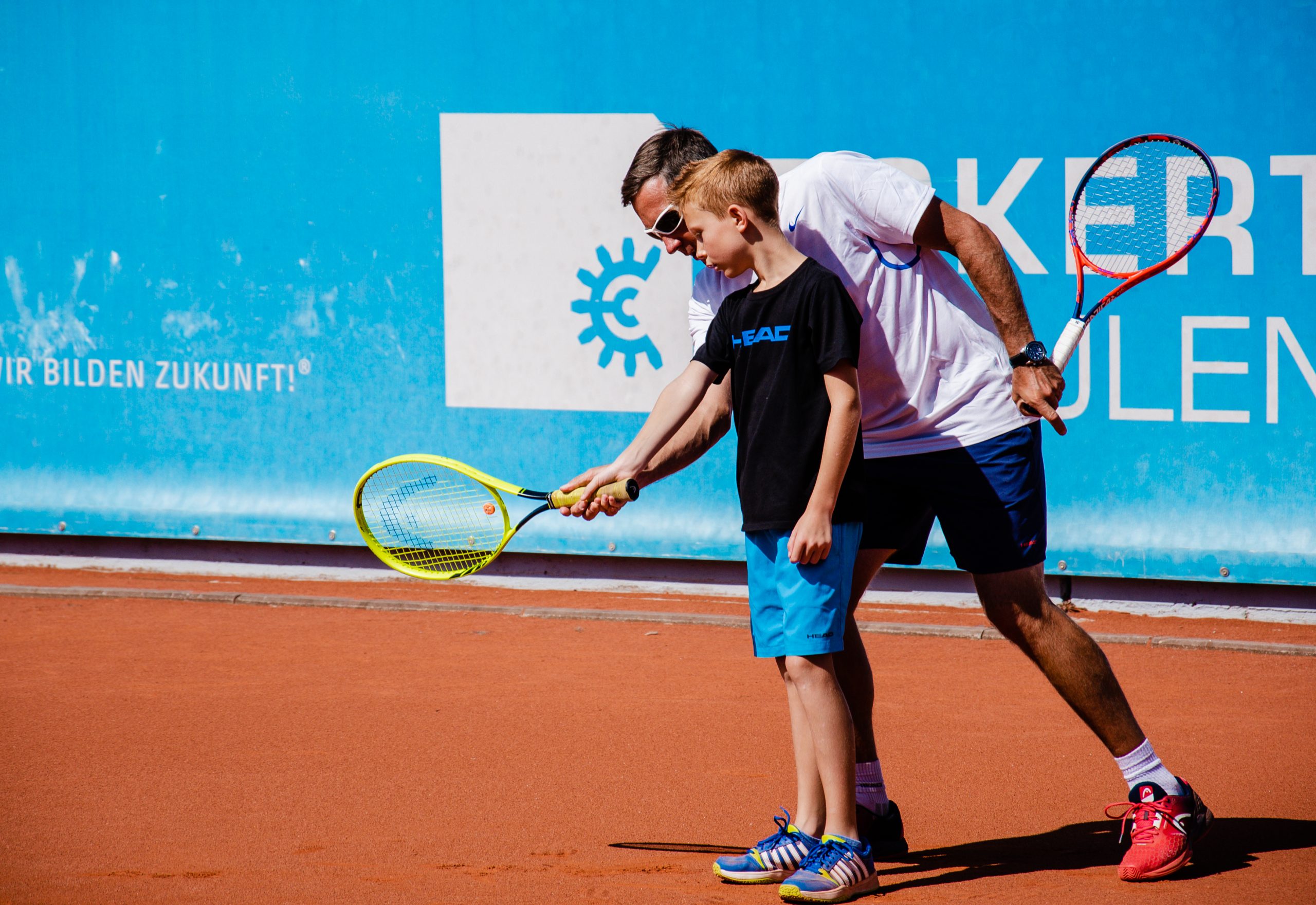 holding tennis racket